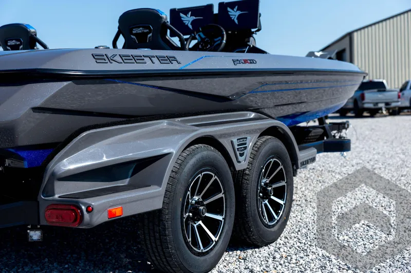 Slide: The Image of 2026 Skeeter FXR21 Apex boat on trailer, showcasing sleek design and modern features. - 16