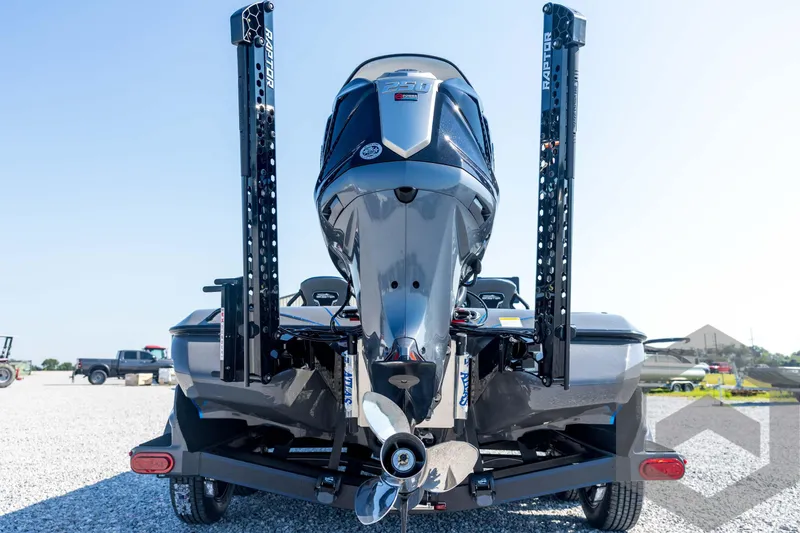 Slide: The Image of Rear view of 2026 Skeeter FXR21 Apex boat with motor and Raptor anchors. - 21