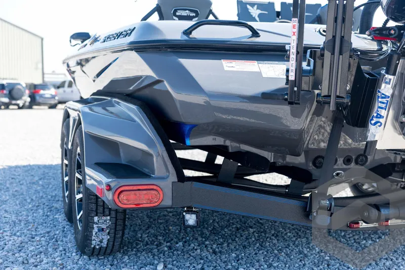 Slide: The Image of 2026 Skeeter FXR21 Apex boat on trailer, showcasing rear design and features. - 23