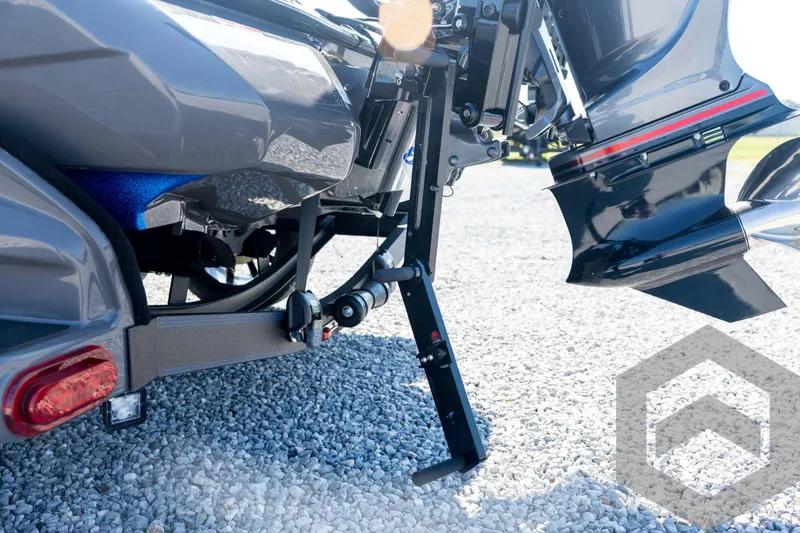 Slide: The Image of 2026 Skeeter FXR21 Apex boat trailer detail on gravel surface. - 25