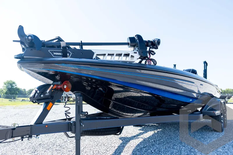 Slide: The Image of 2026 Skeeter FXR21 Apex boat on trailer, featuring Minn Kota trolling motor. - 30