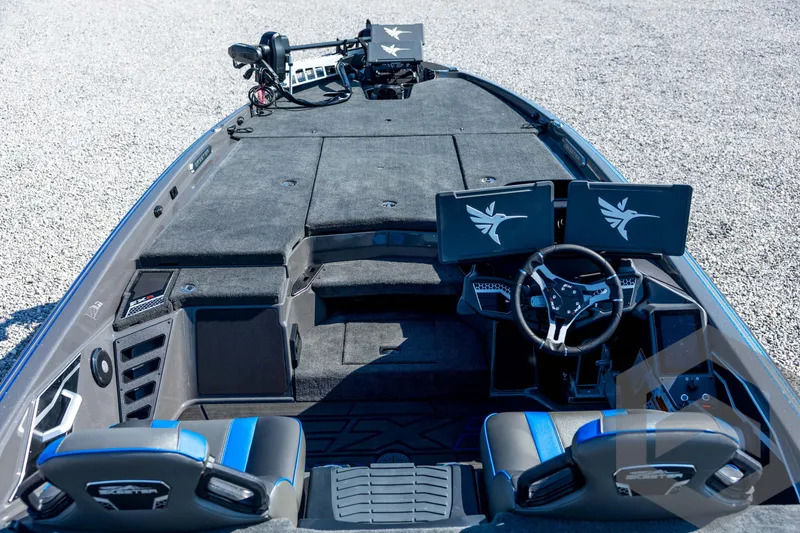 Slide: The Image of 2026 Skeeter FXR21 Apex boat interior with dual screens and modern steering wheel. - 34