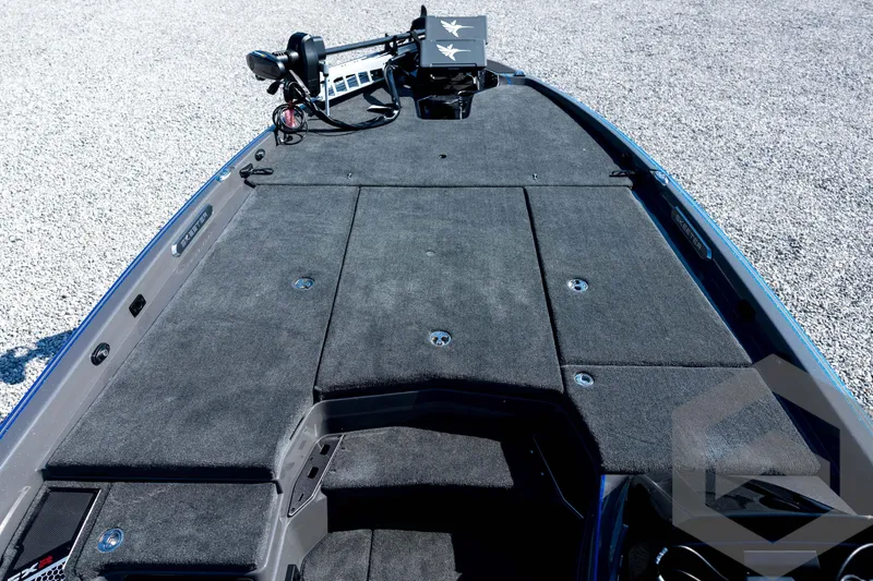 Slide: The Image of 2026 Skeeter FXR21 Apex boat deck with carpeted surface and mounted equipment. - 35