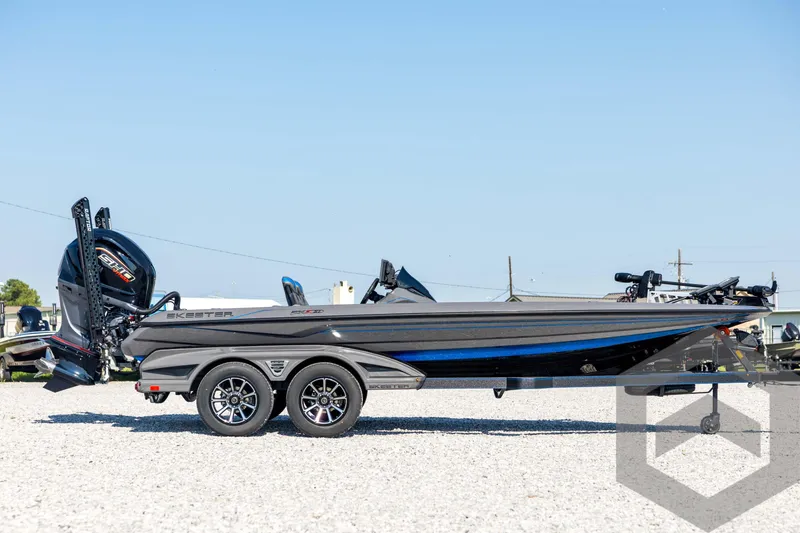 Slide: The Image of 2026 Skeeter FXR21 Apex boat on trailer, side view, outdoors. - 4