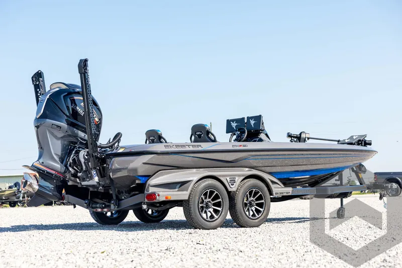 Slide: The Image of 2026 Skeeter FXR21 Apex boat on trailer, featuring sleek design and powerful engine. - 5