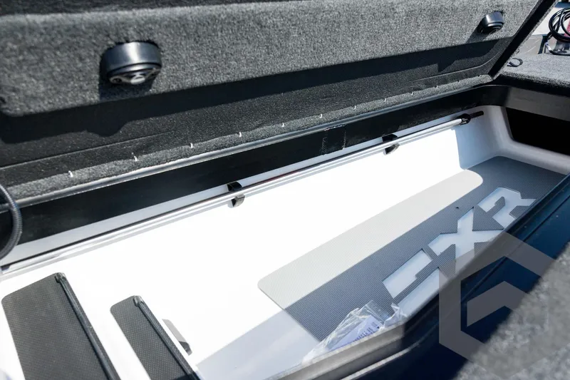 Slide: The Image of 2026 Skeeter FXR21 Apex boat storage compartment with sleek interior design. - 56