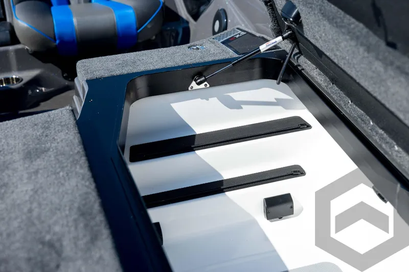 Slide: The Image of Open storage compartment in 2026 Skeeter FXR21 Apex boat interior. - 57