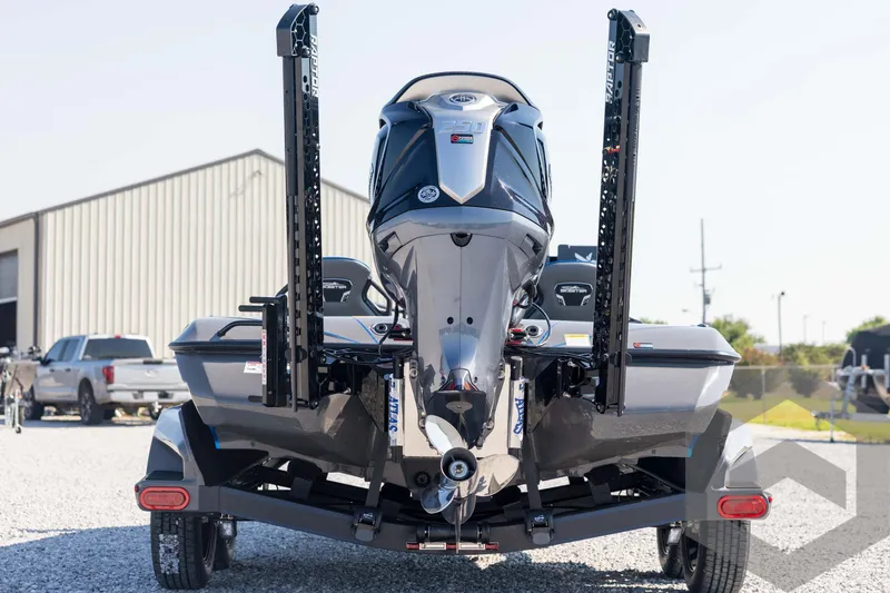 Slide: The Image of 2026 Skeeter FXR21 Apex boat rear view with powerful engine and trailer. - 6