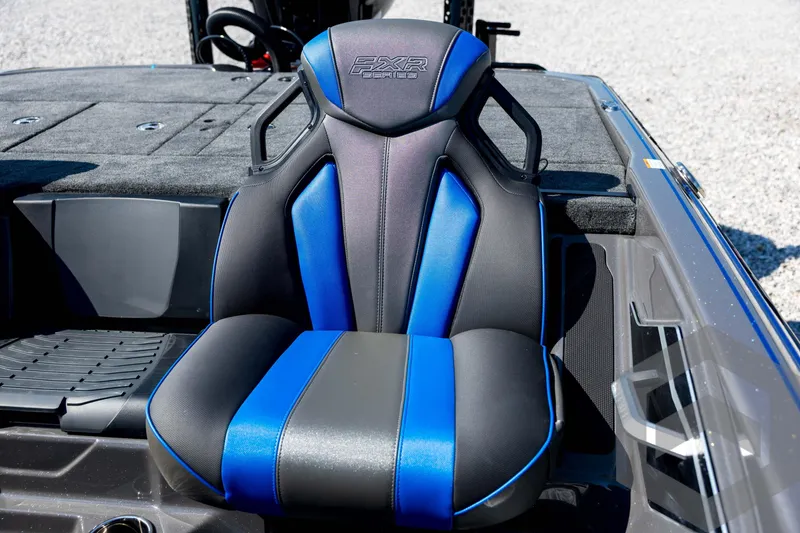 Slide: The Image of 2026 Skeeter FXR21 Apex boat seat with blue and black design. - 60