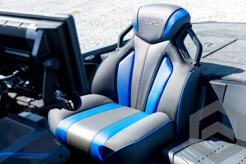 Slide: The Image of 2026 Skeeter FXR21 Apex boat seat with blue and black design, featuring advanced controls. - 61