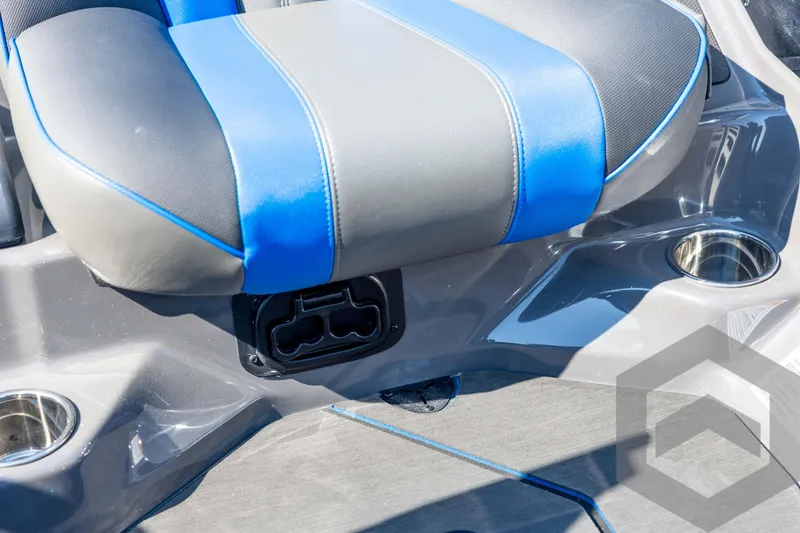 Slide: The Image of 2026 Skeeter FXR21 Apex boat seat with blue accents and cup holders. - 66