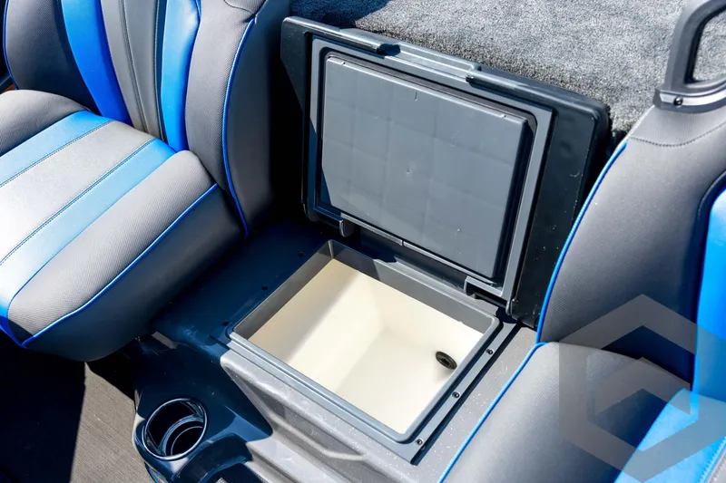 Slide: The Image of 2026 Skeeter FXR21 Apex boat interior with open storage compartment and blue-accented seats. - 69