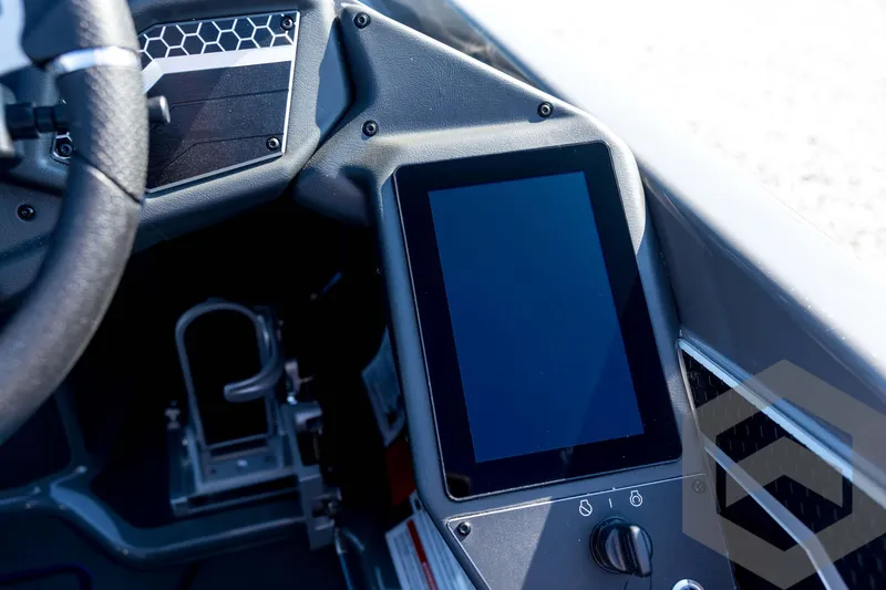 Slide: The Image of 2026 Skeeter FXR21 Apex dashboard with touchscreen display and steering wheel detail. - 71