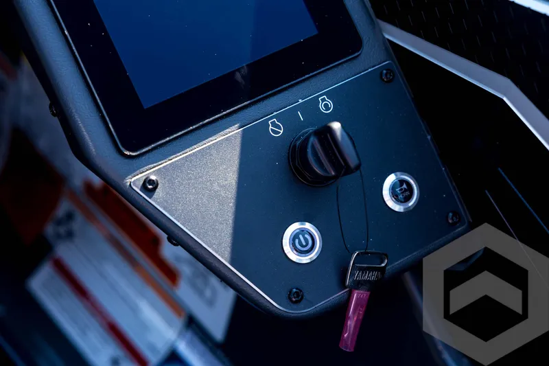 Slide: The Image of Control panel of 2026 Skeeter FXR21 Apex boat with ignition and display screen. - 77