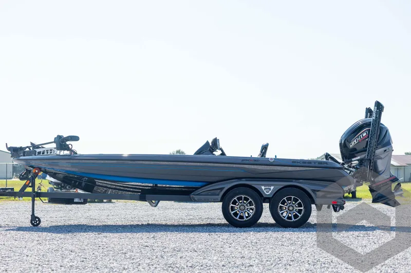 Slide: The Image of 2026 Skeeter FXR21 Apex boat on trailer, side view, outdoors. - 8