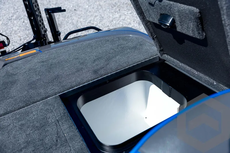 Slide: The Image of Open storage compartment on 2026 Skeeter FXR21 Apex boat deck. - 86