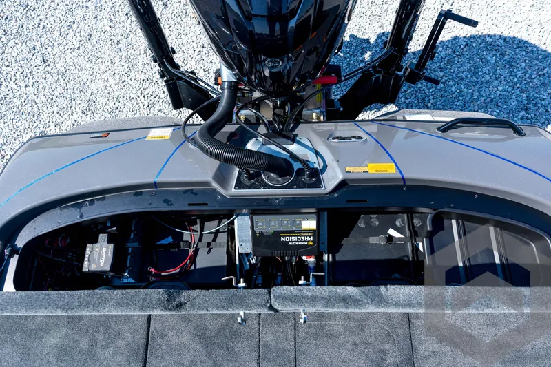 Slide: The Image of Top view of 2026 Skeeter FXR21 Apex boat's engine compartment and wiring. - 87