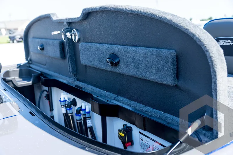 Slide: The Image of 2026 Skeeter FXR21 Apex boat storage compartment with organized wiring and equipment. - 89