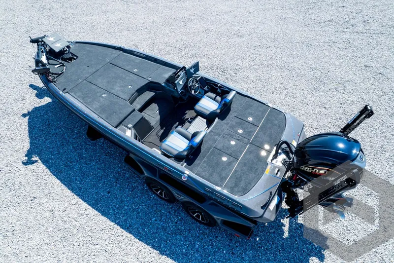 Slide: The Image of 2026 Skeeter FXR21 Apex boat on gravel, featuring sleek design and powerful engine. - 94