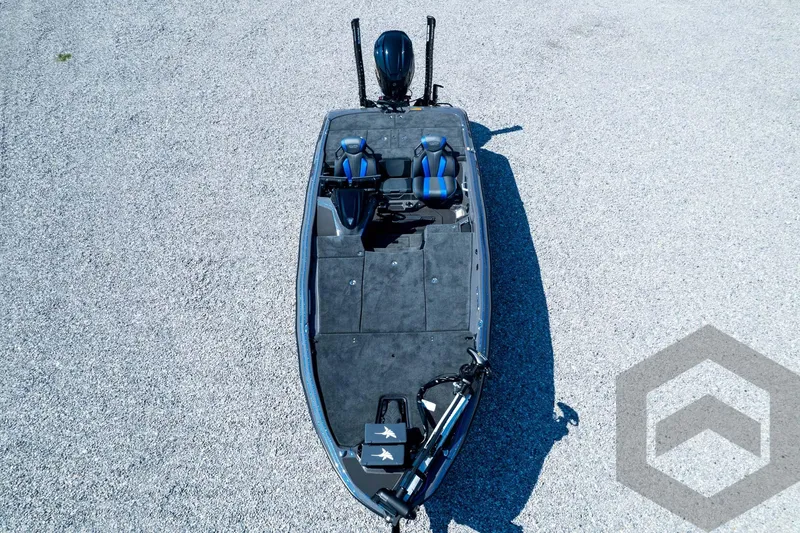 Slide: The Image of 2026 Skeeter FXR21 Apex boat, top view on gravel surface, featuring dual seats and modern design. - 97