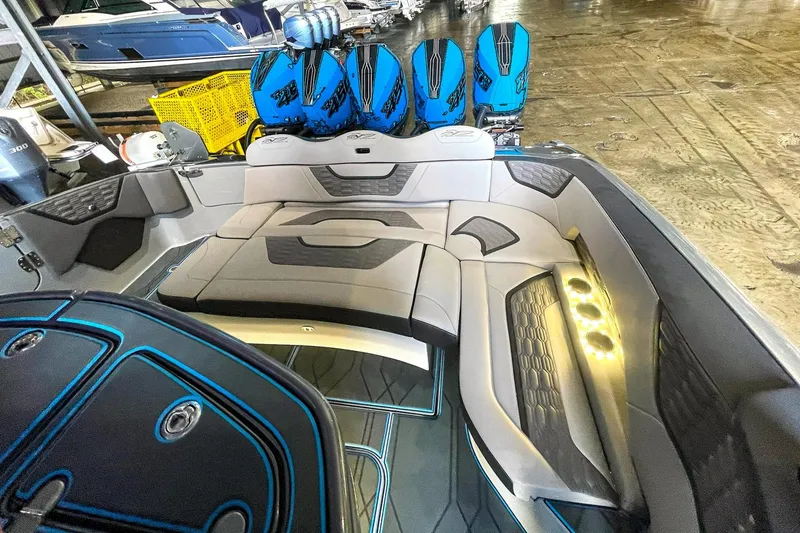 Slide: The Image of Luxurious 2022 MTI V50 boat interior with plush seating and illuminated cup holders. - 4