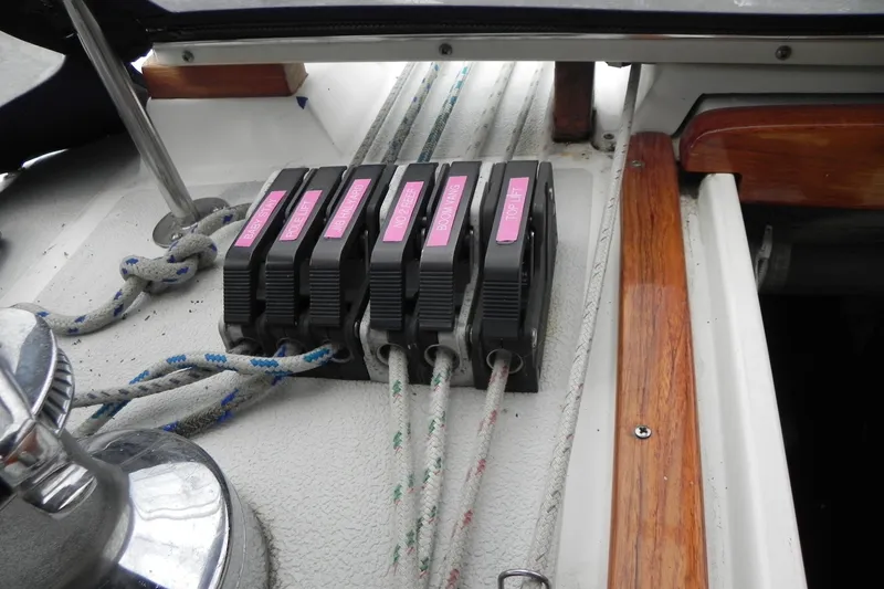 Slide: The Image of Close-up of 1988 Tartan 40 sailboat rope clutches and winch on deck. - 11