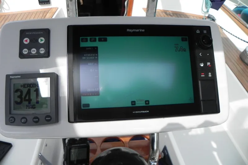Slide: The Image of Cockpit navigation system on a 1988 Tartan 40 sailboat, featuring Raymarine displays. - 14