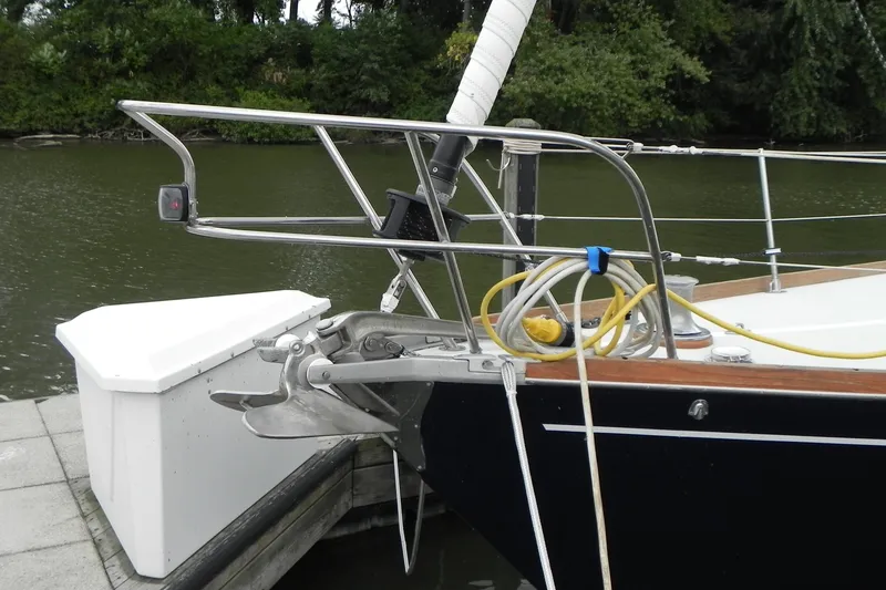 Slide: The Image of 1988 Tartan 40 sailboat bow with anchor and mooring lines at dock. - 2