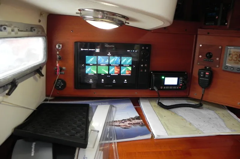 Slide: The Image of Interior of 1988 Tartan 40 sailboat with navigation equipment and charts. - 21