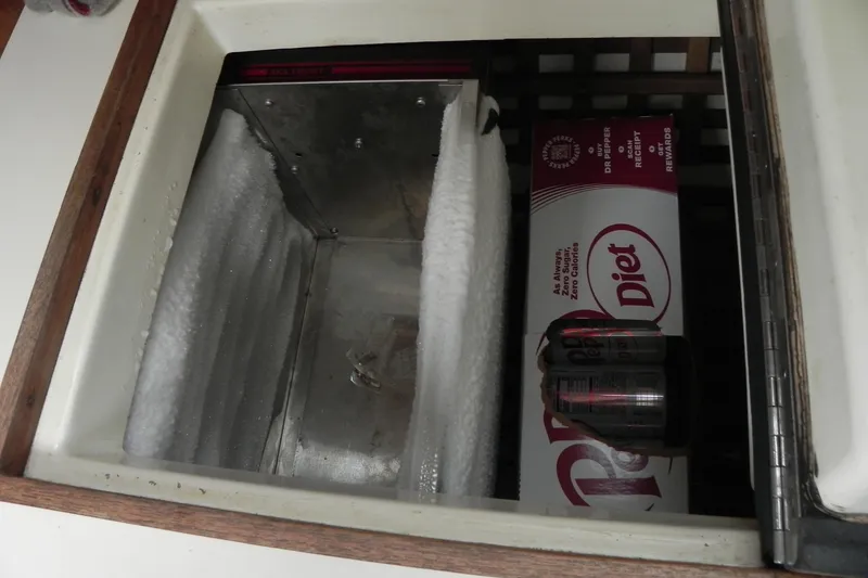 Slide: The Image of Icebox with Diet Dr Pepper cans on a 1988 Tartan 40 sailboat. - 25