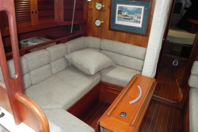 Slide: The Image of Interior of 1988 Tartan 40 sailboat with cozy seating and wooden accents. - 26