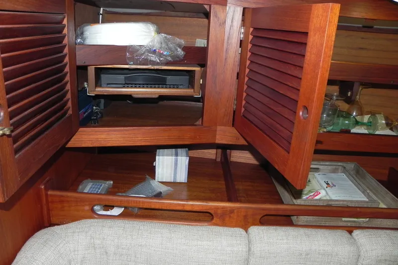 Slide: The Image of Interior of 1988 Tartan 40 sailboat with wooden cabinets and storage compartments. - 27