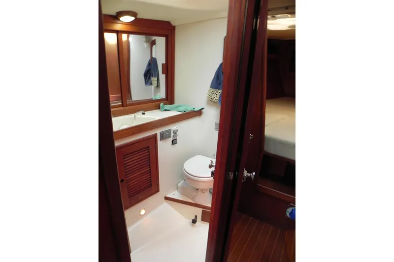 Slide: The Image of 1988 Tartan 40 yacht bathroom with wooden cabinetry and compact design. - 31