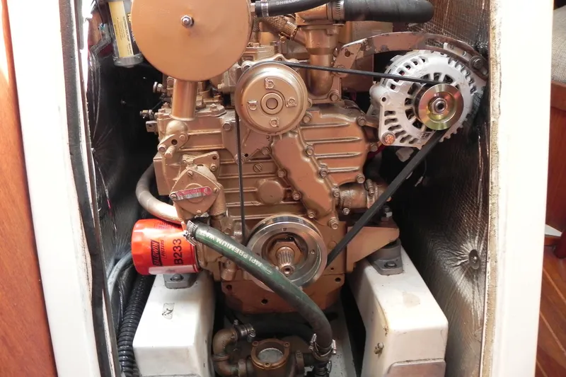Slide: The Image of Engine compartment of a 1988 Tartan 40 sailboat, featuring a detailed view of the engine. - 33