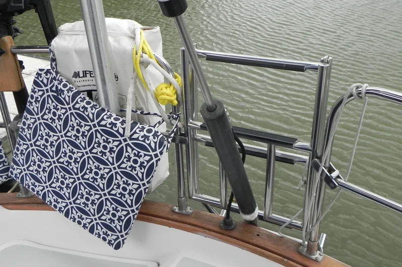 Slide: The Image of Sailboat deck with patterned cushion and life preserver, Tartan 40, 1988 model. - 8