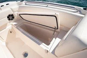 Slide: The Image of 2026 Grady-White Freedom 275 boat interior storage compartment open on deck. - 10