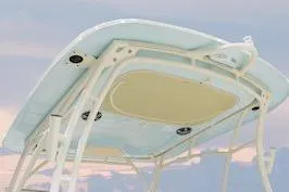 Slide: The Image of 2026 Grady-White Freedom 275 boat top view against a pastel sky. - 7