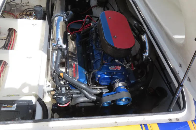 Slide: The Image of 2003 Spectre 36 Cat engine compartment with Mercury engine, detailed view. - 10