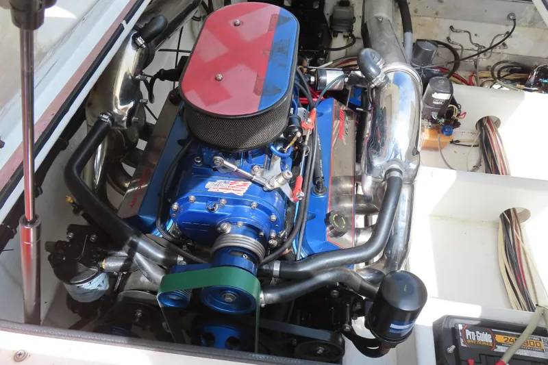 Slide: The Image of Engine of a 2003 Spectre 36 Cat boat, featuring a high-performance setup. - 11