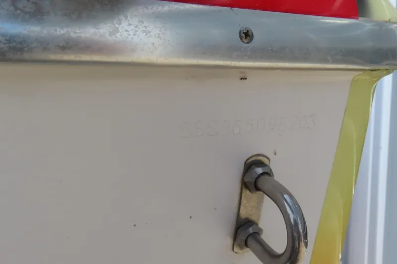 Slide: The Image of 2003 Spectre 36 Cat boat hull identification number and metal fitting detail. - 21