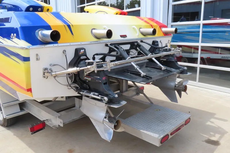 Slide: The Image of 2003 Spectre 36 Cat boat with vibrant paint and dual Mercury XR drives. - 22