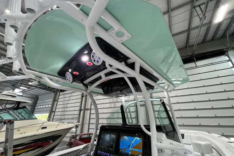 Slide: The Image of 2026 Wellcraft 302 Fisherman boat interior with advanced navigation system and sleek design. - 17