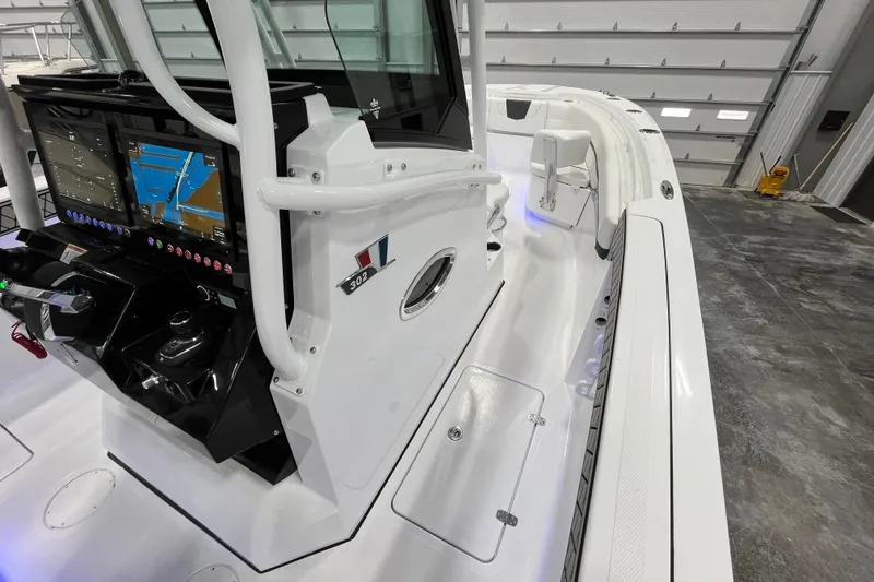 Slide: The Image of 2026 Wellcraft 302 Fisherman boat interior with advanced navigation system and sleek design. - 26