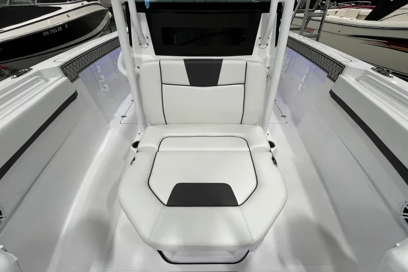 Slide: The Image of 2026 Wellcraft 302 Fisherman boat interior with white seating and modern design. - 31