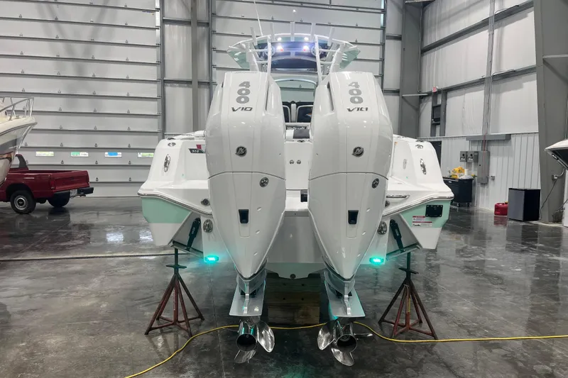 Slide: The Image of 2026 Wellcraft 302 Fisherman boat with dual 400 V10 engines in a garage. - 6