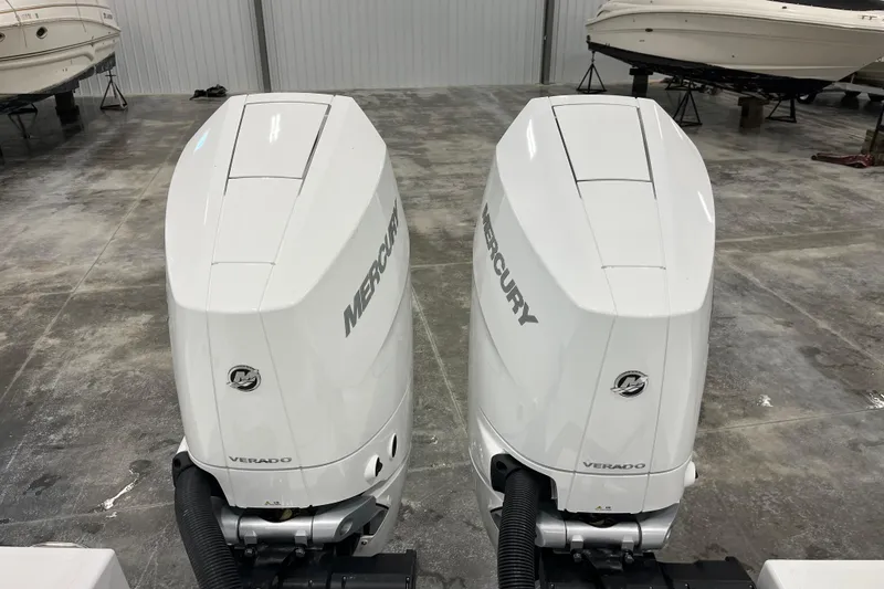Slide: The Image of Twin Mercury Verado outboard engines on a 2026 Wellcraft 302 Fisherman boat. - 8