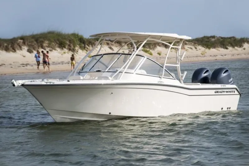 The Image of 2026 Grady-White Freedom 255 boat on water near sandy beach. - 3