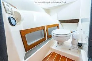 Slide: The Image of 2026 Grady-White Freedom 235 boat interior with optional electric flush toilet. - 11