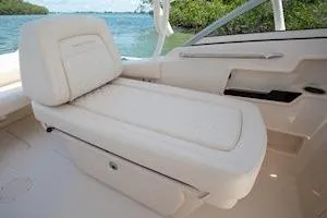 Slide: The Image of 2026 Grady-White Freedom 235 boat interior with comfortable seating and scenic water view. - 15