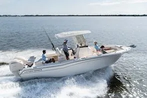 Slide: The Image of 2026 Grady-White Fisherman 257 boat cruising on open water with passengers. - 15